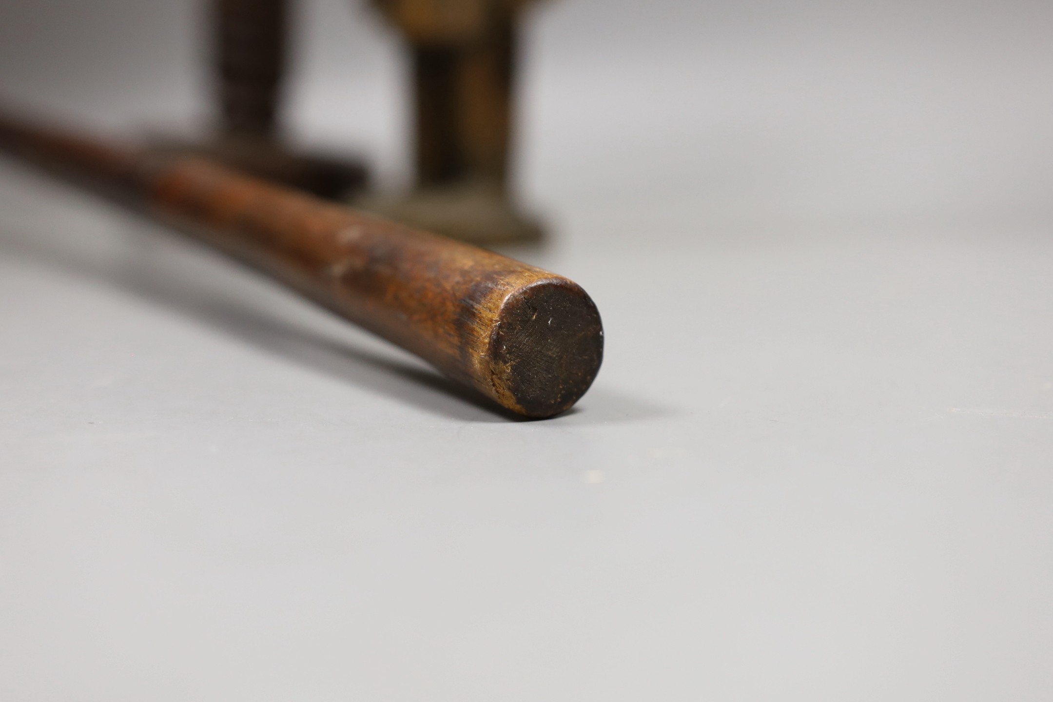 A Zulu knobkerrie, an Ibeji wood figure and a Gabon Fanti fertility figure- Knobkerrie 73 cms long.